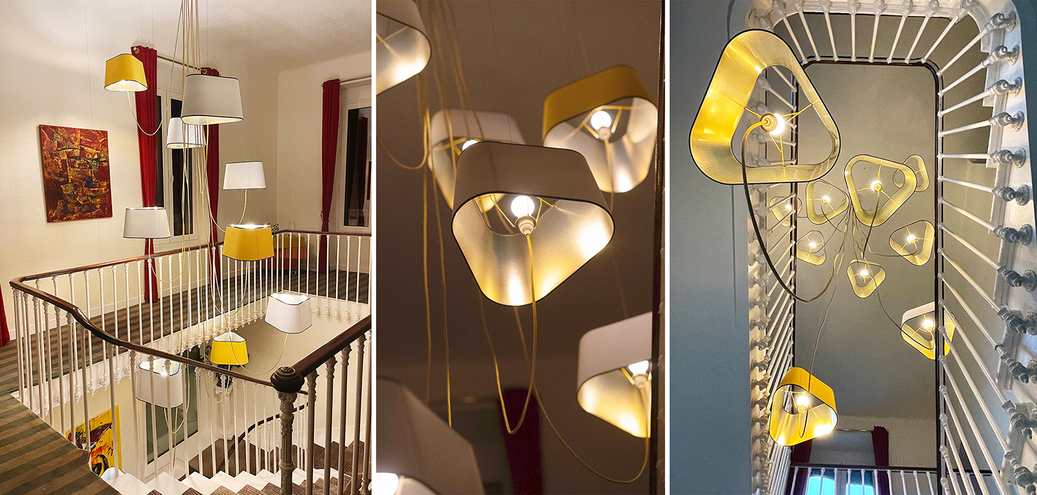 Lustre en spiral ascendante pour &eacute;clairer un escalier historique - Luminaire design par DESIGNHEURE